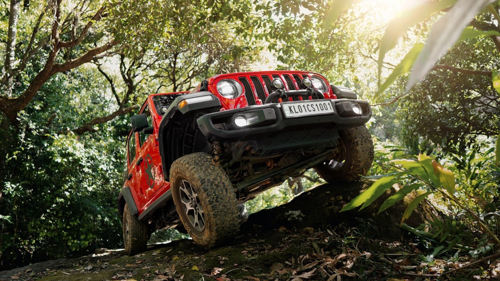 A 4x4 picking its way up a rocky obstacle, illustrating careful tire placement and line selection