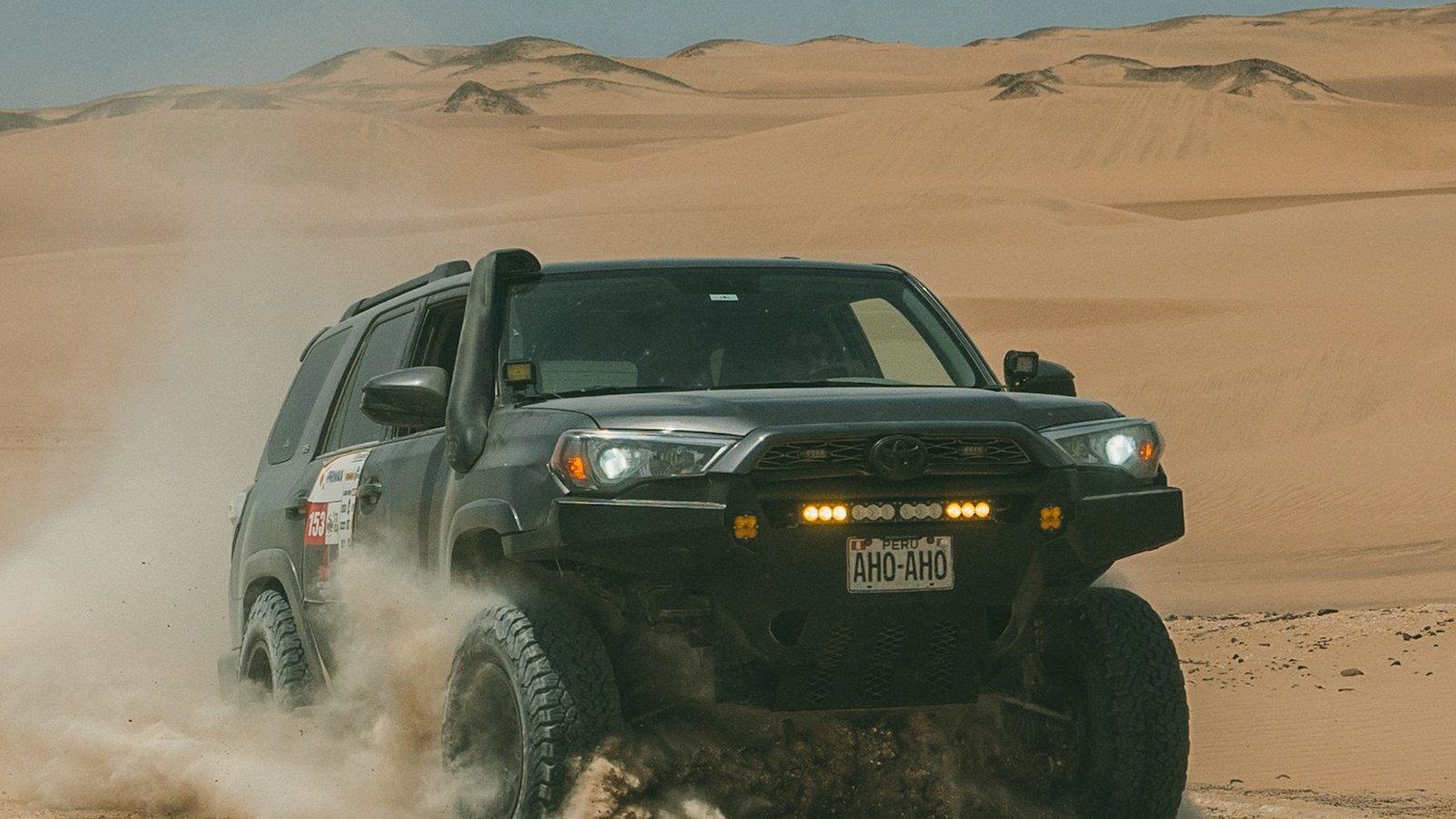 4Runner kicking up dust on a desert route