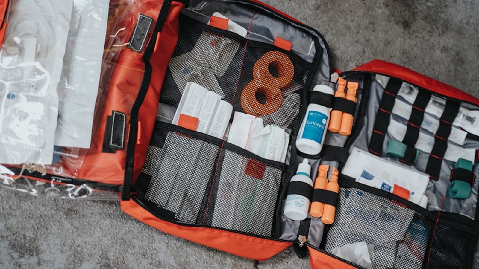 Organized trail trauma kit with sorted compartments of medical supplies
