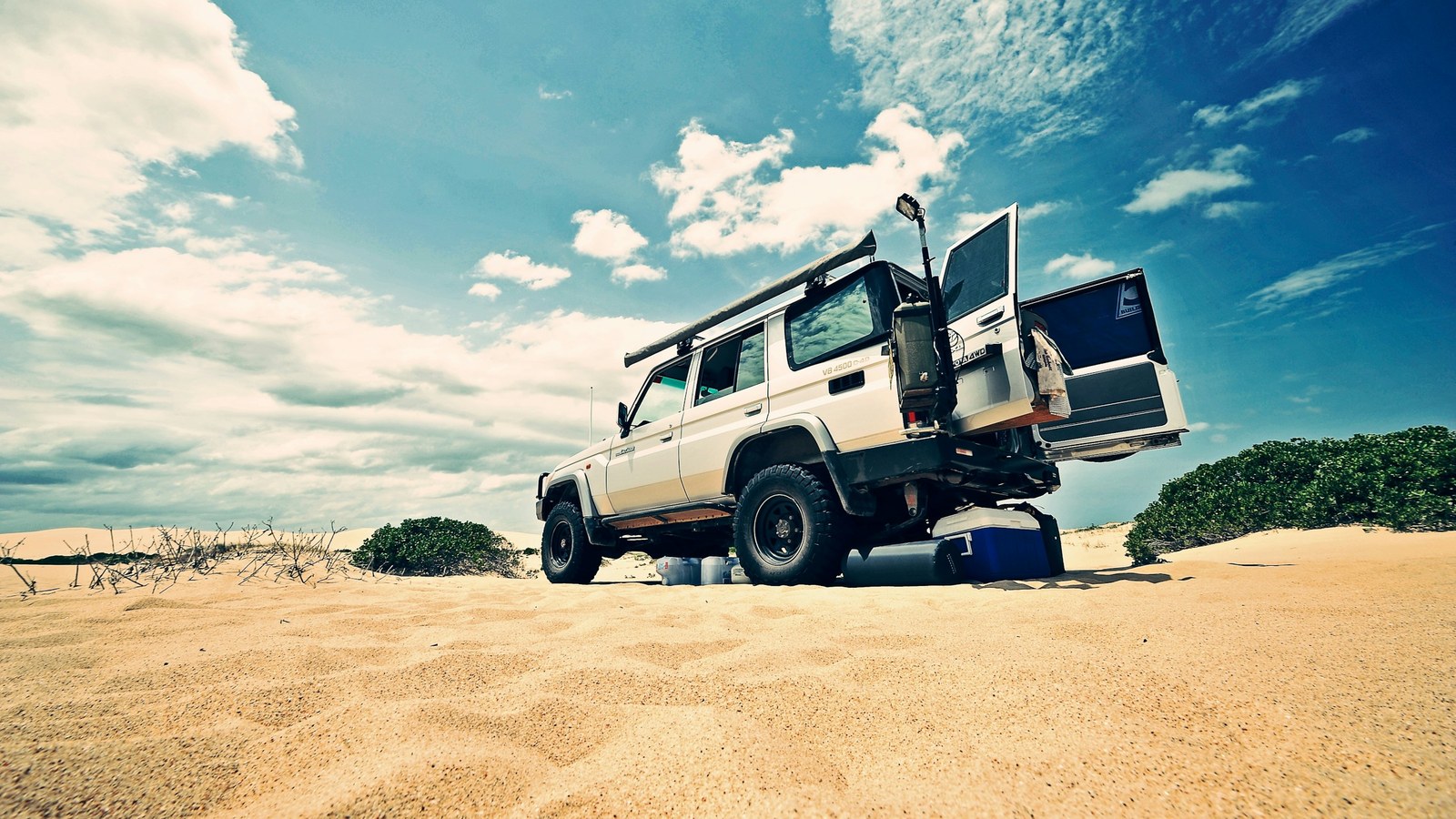 Toyota Land Cruiser overland rig parked at a remote camp