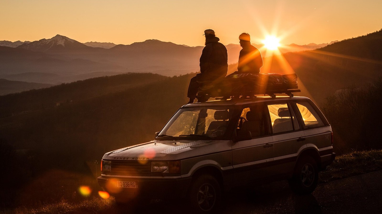 A lone overland rig at golden hour on a mountain ridge, the payoff of solo overlanding done right.