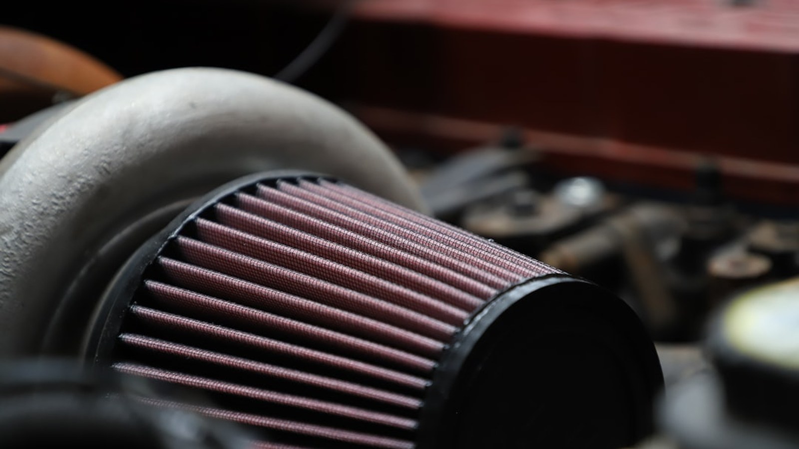 Close-up of a vehicle air filter, the high-payoff component to inspect after dusty or muddy off-road runs