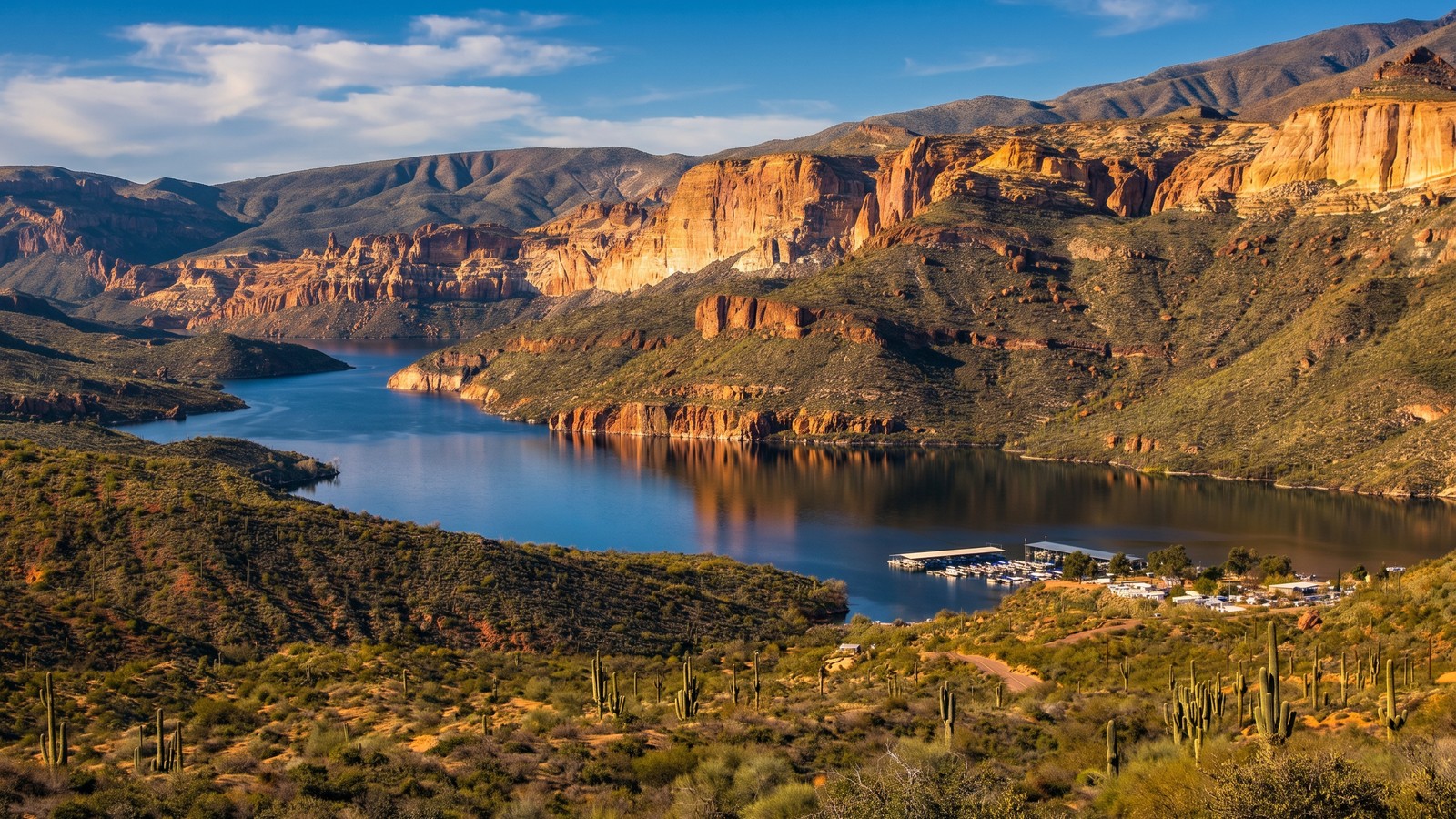 Apache Lake, a remote blue reservoir with a marina framed by rugged desert cliffs along the Apache Trail