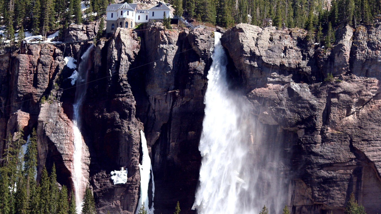 Bridal Veil Falls plunging off the cliffs above Telluride, the tallest free-falling waterfall in Colorado, seen early on the climb up Imogene